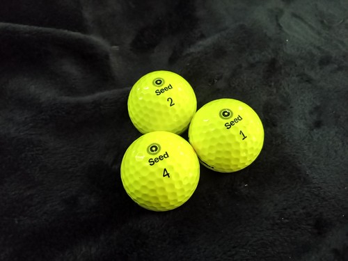 Yellow seed golf balls in - seed,